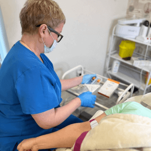 Helena working in the treatment room at Helena Aesthetics UK